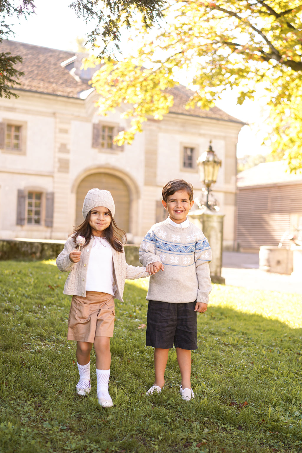 Children's cable knit cardigan in pure ultrafine merino wool