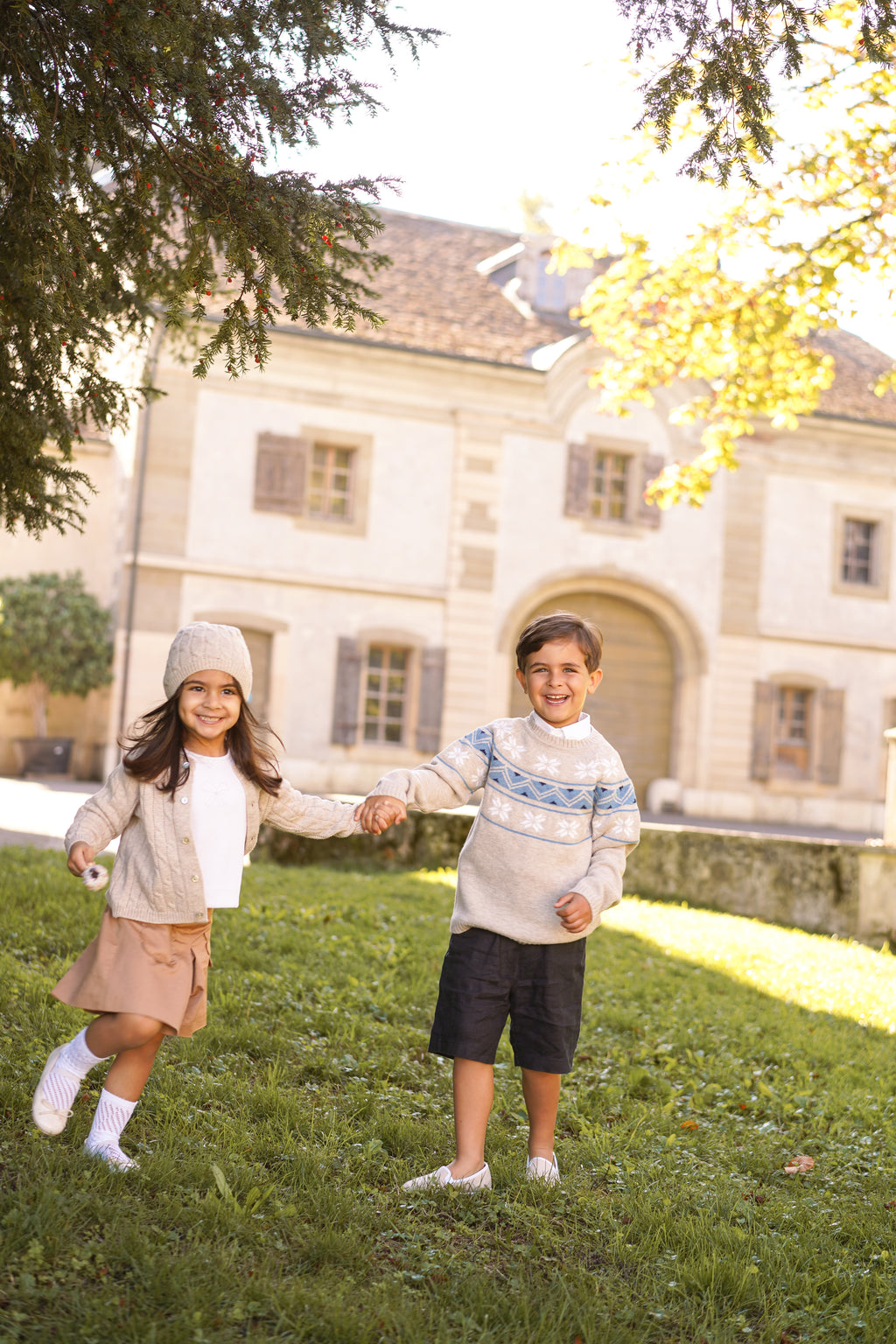 Children's cable knit cardigan in pure ultrafine merino wool