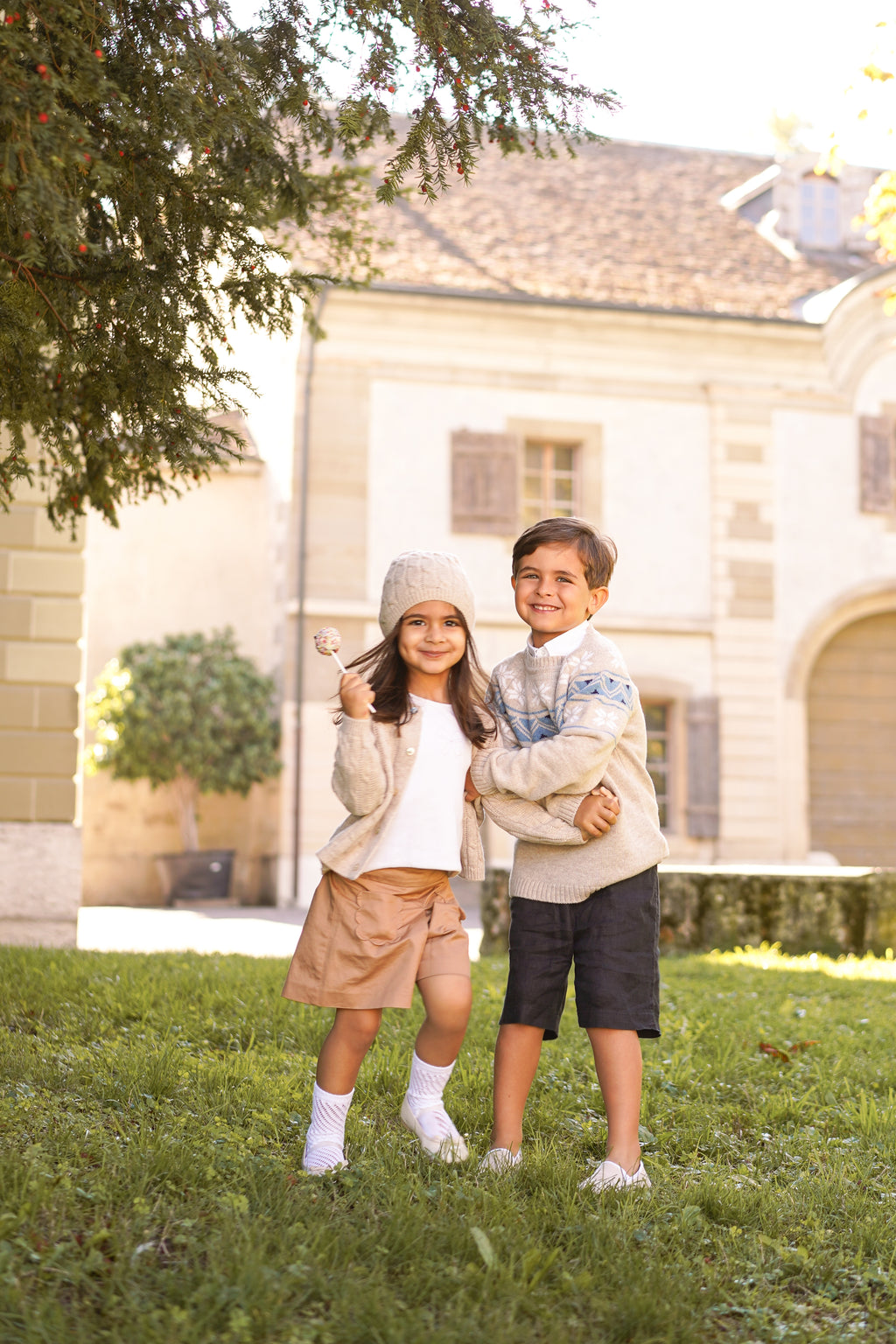 Children's cable knit cardigan in pure ultrafine merino wool